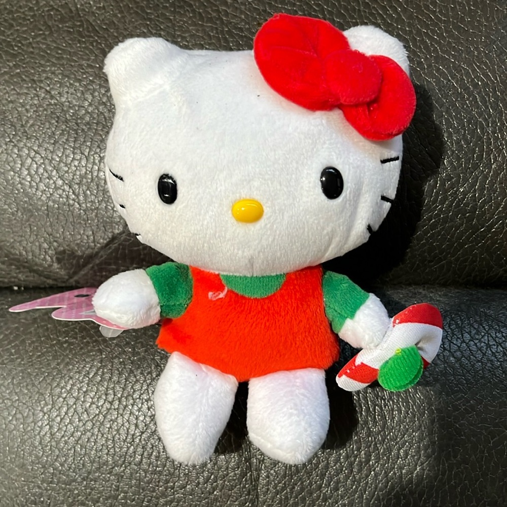 Hello kitty holding candy cane